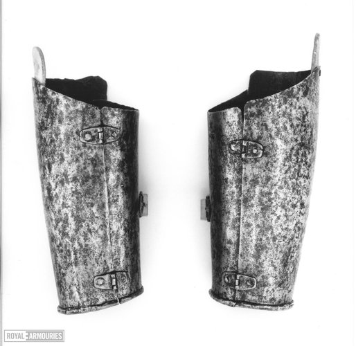 A pair of forearm protectors (vambraces).
